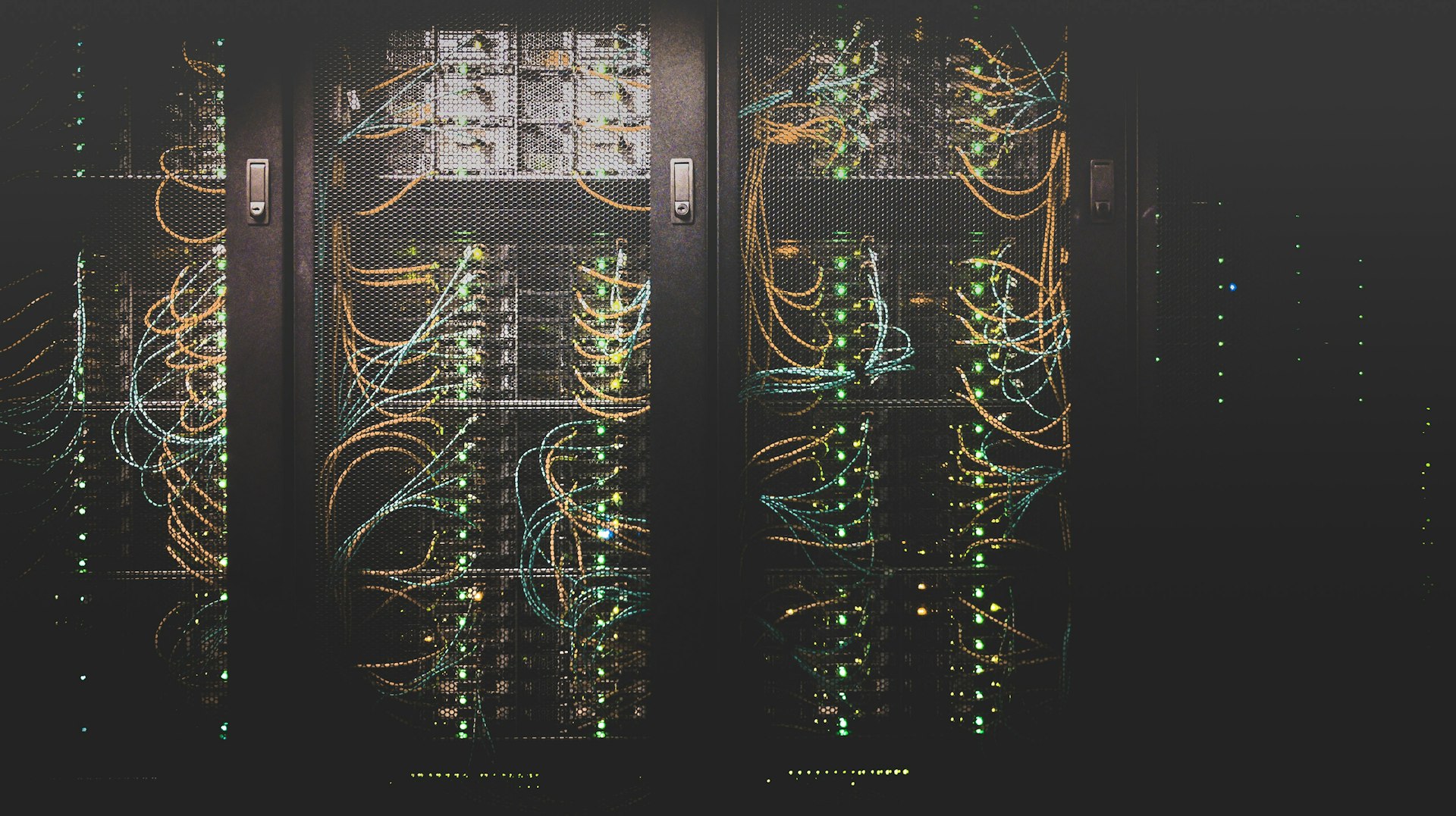 Close-up of enterprise server racks with active network cabling